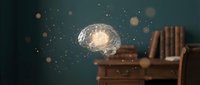 Glowing brain floating above wooden desk with books in dark room with sparkling particles, representing knowledge, learning, education and mental power.