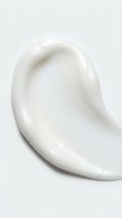 Creamy white skincare product smear with smooth, luxurious texture isolated on neutral background. Use for cosmetics, beauty, and wellness marketing.