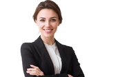 Young professional woman in black business suit and white blouse smiling confidently with arms crossed against white background, representing leadership and success.