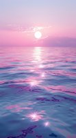 Dreamy ocean sunset with pink and purple sky reflecting on rippling water surface, sun creating magical sparkles and light path across tranquil seascape.