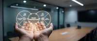 Hands holding glowing value wheel diagram with segments in modern office conference room, representing business strategy, core values, and organizational planning for corporate presentations.