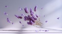 Dried lavender bouquet with falling petals in soft sunlight against white wall, creating gentle shadows and serene atmosphere.