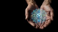 Elderly hands gently holding glowing mandala symbol with yin yang center on black background representing spiritual balance and meditation practice.
