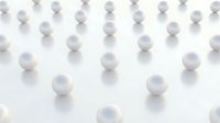 White spheres arranged in geometric pattern on clean surface creating minimalist abstract composition for modern design projects and presentations.