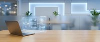 Modern office workspace with laptop displaying holographic business analytics interface on wooden desk in contemporary corporate environment.