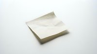 Blank adhesive note pad isolated on white background, ready for design mockups, branding presentations, and stationery templates.