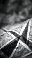 Close-up of geometric striped fabric with sharp shadows and texture detail, suitable for design, fashion, and textile industry projects.