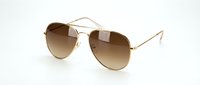 Classic aviator sunglasses with gold metal frame and brown gradient lenses isolated on white background for fashion and eyewear design projects.