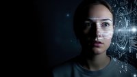 Young woman with futuristic holographic interface projection displaying digital data and technology elements in dark sci-fi environment.