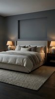 Modern bedroom interior with gray upholstered bed, neutral bedding, warm table lamps, and blank wall art frame for home decor and interior design projects.