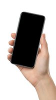 Hand holding modern smartphone with blank black screen isolated on white background for mobile app mockup and digital presentation.