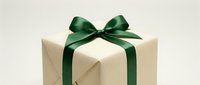 Elegant gift box wrapped in cream paper with a dark green satin ribbon bow, perfect for holiday, birthday, or special occasion greeting cards.