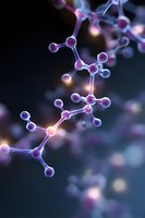 Glowing molecular structure with pink and purple atoms connected by bright bonds against dark background, illustrating scientific concept of chemistry.