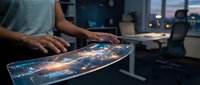 Professional man analyzing digital data visualization on futuristic transparent display in modern office environment for business intelligence applications.