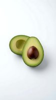 Fresh avocado halves with pit isolated on white background, ready for culinary, nutrition, and healthy eating design projects.
