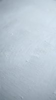 White painted wood surface with visible brush strokes and texture for rustic interior design and crafting projects.