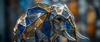 Stunning mosaic elephant sculpture with blue and gold stained glass pieces creating intricate geometric patterns on metallic framework for artistic decor.