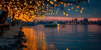 Magical waterfront at sunset with string lights creating golden bokeh reflections on calm water, urban skyline silhouette in distance.