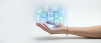 Open palm hand holding glowing digital network of connected data blocks and technology icons, representing cloud computing, data management, and digital transformation solutions.