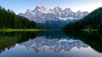 Majestic mountain peaks with snow-capped summits reflecting in crystal clear alpine lake waters, surrounded by dense evergreen forest creating mirror-like symmetry at dawn.