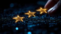 Glowing golden stars with sparkles on dark blue background, finger touching magical light effect. Festive holiday concept with bokeh and glitter elements.