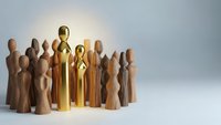 Golden leader figure standing out among wooden team members in circle formation representing leadership excellence and business success concepts.