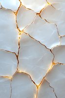 Glowing golden cracks on white marble surface create abstract pattern with illuminated veins, suggesting kintsugi art technique and luxury design aesthetic.