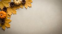 Autumn corner border with golden maple leaves, small pumpkins and pine cones on neutral beige background with copy space for seasonal designs.