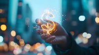 Glowing dollar sign floating above hand with magical sparkles against blurred city lights background, representing financial technology and digital money concept.