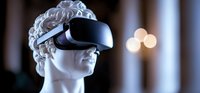 Modern VR headset on classical marble bust against dark background with soft bokeh lights creating futuristic contrast between ancient and contemporary technology.
