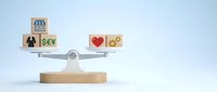 Wooden balance scale with business and personal life blocks showing work-life balance concept for career management and lifestyle choices.