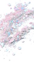 Scattered iridescent glitter and sequins in pink, blue, and silver tones on white background, suitable for festive, beauty, and celebration design projects.