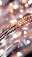 Abstract curved lines with glowing orange and white bokeh lights on gray background, sparkling magical effect creates dreamy atmosphere for festive designs.