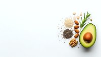 Healthy omega-3 rich foods including avocado, nuts, seeds and herbs arranged on white background for nutrition and wellness concepts.