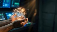 Businessman holding glowing brain hologram with gear mechanisms representing artificial intelligence and innovation in modern technology workspace.