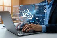 Businessman using laptop with cloud computing technology interface displaying data management and digital transformation solutions in modern office.