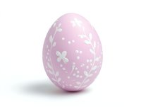 Pink Easter egg decorated with white floral and leaf patterns on isolated background, ready for holiday designs and seasonal celebrations.