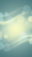 Soft blurred bokeh background with dreamy light leaks and gentle cream tones blending into muted teal, perfect for overlays and design projects.