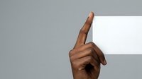 Male hand with medium-dark skin tone pointing upward against neutral background, suitable for business presentations, educational materials, and directional graphics.