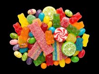 Colorful mixed candy pile with gummy bears, sour strips, lollipops, and jelly beans, isolated on transparent background, ready for stickers, t-shirt design, and print on demand.