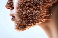 Female profile with digital particle effect dissolving face, representing artificial intelligence and digital transformation in modern technology.