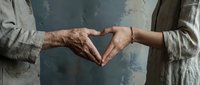 Two hands forming heart shape showing intergenerational love and connection between elderly and young person against textured wall background.