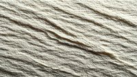 Natural beige rope texture with twisted fibers creating diagonal pattern. Organic hemp or jute material background for rustic design projects and crafts.