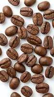 Roasted coffee beans scattered on white background showing rich brown texture and natural cracks for cafe branding and beverage marketing materials.