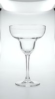 Empty clear margarita glass with elegant stem on white background, isolated for bar, restaurant menu, cocktail party, and beverage design use.