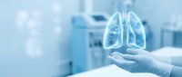 Medical professional holding glowing lung anatomy model in healthcare setting for respiratory system education and pulmonary health awareness campaigns.