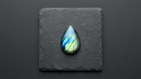 Polished labradorite gemstone with blue and green flash on dark slate surface for jewelry making and mineral collection display.