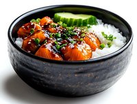 Fresh salmon sashimi bowl with white rice, cucumber slices, sesame seeds and green onions served in traditional black ceramic bowl on dark background.