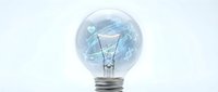 Light bulb with blue energy waves and electrical circuits inside representing innovation and creative ideas for business technology concepts.
