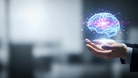 Businessman hand holding glowing digital brain with neural network connections representing artificial intelligence and machine learning technology.
